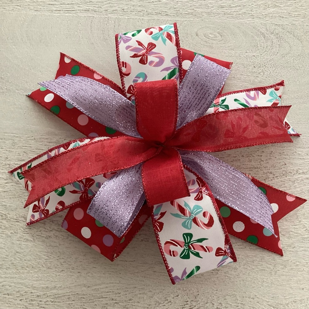 Festive Red, Purple, And White Candy Cane Bow
